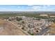 Wide aerial shot showcasing a residential area nestled beside sprawling fields and forests at 2601 Rosehip Ct., Conway, SC 29527