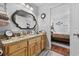 Bathroom featuring a wood vanity, granite counters, a large framed mirror and tile flooring at 2601 Rosehip Ct., Conway, SC 29527