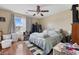 A bedroom with hardwood floors, neutral walls, and an interesting ceiling fan at 2601 Rosehip Ct., Conway, SC 29527