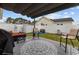 Covered patio with stylish furniture and a decorative rug, creating a cozy and inviting outdoor living space at 2601 Rosehip Ct., Conway, SC 29527