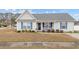 Charming single-story home with blue shutters and a cozy front porch at 2601 Rosehip Ct., Conway, SC 29527