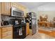 Well-equipped kitchen with wood cabinets, granite countertops, and modern appliances, perfect for cooking and entertaining at 2601 Rosehip Ct., Conway, SC 29527