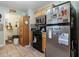 Cozy kitchen area with wood cabinets, tiled backsplash, stainless steel refrigerator, and pantry at 2601 Rosehip Ct., Conway, SC 29527
