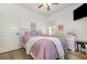 Bright bedroom with wood floors, TV, and charming decor at 2724 A C Ln, Conway, SC 29526