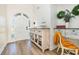 Bright entryway featuring a decorative cabinet and an arched front door at 2724 A C Ln, Conway, SC 29526