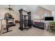 Spacious gym featuring a treadmill and weight machine, well-lit by natural light at 2724 A C Ln, Conway, SC 29526