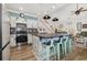 Modern kitchen with an island, bar stool seating and open to living room and stairs at 2724 A C Ln, Conway, SC 29526