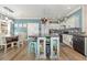 Kitchen and Dining Area features an island with seating and stainless steel appliances at 2724 A C Ln, Conway, SC 29526