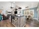 Open-concept living area with kitchen island, dining space, and cozy seating area at 2724 A C Ln, Conway, SC 29526
