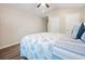 Bedroom with neutral walls, a ceiling fan, and a comfortable queen bed with coastal-themed bedding at 31 Tidelands Trail, Pawleys Island, SC 29585