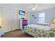 Bright bedroom featuring two beds, beachy decor, closet, and ceiling fan at 340 Lands End Blvd. # 18, Myrtle Beach, SC 29572