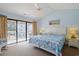 Bright bedroom featuring a balcony with outdoor seating and beach-themed decor at 340 Lands End Blvd. # 18, Myrtle Beach, SC 29572