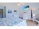 Bright bedroom featuring beachy decor, a TV, and convenient bathroom access at 340 Lands End Blvd. # 18, Myrtle Beach, SC 29572