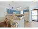 Bright kitchen with blue cabinets, laminate countertops and floors, and a breakfast bar at 340 Lands End Blvd. # 18, Myrtle Beach, SC 29572