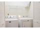 Well-lit laundry room with a Maytag washer and dryer, plus overhead wire shelving for storage at 340 Lands End Blvd. # 18, Myrtle Beach, SC 29572