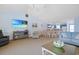 Bright living room with open layout, beach themed decorations, and dining area in background at 340 Lands End Blvd. # 18, Myrtle Beach, SC 29572