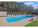 Sparkling community swimming pool with lounge chairs, surrounded by lush landscaping at 340 Lands End Blvd. # 18, Myrtle Beach, SC 29572