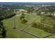 Aerial view of neighborhood with green spaces, trees, and community roads at 369 Myrtle Meadows Dr # 417C, Conway, SC 29526
