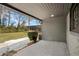 Covered back porch showcasing an outdoor living space and view of the backyard at 3807 Casey St., Loris, SC 29569