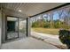 Covered back patio with sliding glass doors that lead into the home and views of the green backyard at 3807 Casey St., Loris, SC 29569