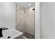 Modern bathroom showcasing stylish shower with marble tiles and black hardware at 3807 Casey St., Loris, SC 29569