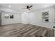 Bright bedroom featuring modern ceiling fan, recessed lighting, and wood-look flooring at 3807 Casey St., Loris, SC 29569