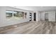 Spacious living room filled with natural light, vinyl plank flooring, and neutral walls at 3807 Casey St., Loris, SC 29569