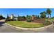 Inviting entrance to Waterbridge community with lush landscaping, water feature, and decorative brick signage at 385 Starlit Way, Myrtle Beach, SC 29579