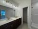 Modern bathroom with double vanity, quartz countertop, and tiled floors at 4000 Braid Ct., Myrtle Beach, SC 29588