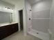 Bathroom features a shower with bronze fixtures, tiled floors and white walls at 4000 Braid Ct., Myrtle Beach, SC 29588