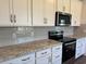 Stylish kitchen featuring granite countertops, tile backsplash, and stainless steel appliances at 4000 Braid Ct., Myrtle Beach, SC 29588