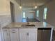 Kitchen island featuring a stainless steel dishwasher, sink and pendant lights at 4000 Braid Ct., Myrtle Beach, SC 29588