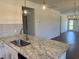 Close up of kitchen island with a sink and a view of an open living space at 4000 Braid Ct., Myrtle Beach, SC 29588