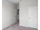 Neutral bedroom with carpet flooring, white walls, and a closet with a white door at 439 Falling Leaf Loop, Myrtle Beach, SC 29588