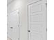 Bright hallway featuring paneled doors and neutral wall paint at 439 Falling Leaf Loop, Myrtle Beach, SC 29588