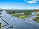 Panoramic aerial view of a marina with boats and waterway; picturesque coastal living at its finest at 4239 Rivergate Ln., Little River, SC 29566