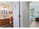 Charming bathroom boasts a wood vanity, decorative mirror, and stylish towel storage at 4239 Rivergate Ln., Little River, SC 29566