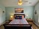 Inviting bedroom featuring soft lighting, wall art, and wood furniture at 4239 Rivergate Ln., Little River, SC 29566
