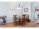 This dining room features beach-themed decorations and a view of the kitchen area at 4239 Rivergate Ln., Little River, SC 29566