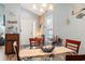 Cozy dining area features beach-themed decorations and a view of the front door and hallway at 4239 Rivergate Ln., Little River, SC 29566