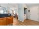 Charming kitchen featuring wood cabinets, adjacent dining area and laundry closet at 4239 Rivergate Ln., Little River, SC 29566