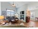 Bright living room with vaulted ceilings, a ceiling fan, modern decor, and a cozy seating area at 4239 Rivergate Ln., Little River, SC 29566
