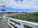 Scenic view of a marina with boats, docks, and lush greenery against a blue sky at 4239 Rivergate Ln., Little River, SC 29566
