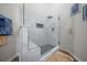 Modern shower with glass enclosure, marble-look tile, and built-in bench seating at 4239 Rivergate Ln., Little River, SC 29566