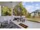 Enjoy the outdoor space of this patio with its stone table set, two rocking chairs, and view of the landscaped backyard at 430 7Th Ave. S, North Myrtle Beach, SC 29582