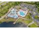 Overhead view of the resort-style community pool with a lazy river, splash pad, clubhouse, and playground at 4321 Hawkins Dr., Myrtle Beach, SC 29579