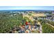 An aerial view pointing to a residential area near a golf course with lush green trees at 4494 Aberdeen Way, Myrtle Beach, SC 29579