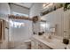 Cozy bathroom with striped wallpaper, ample counter space, and decorative accents at 4494 Aberdeen Way, Myrtle Beach, SC 29579