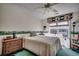 Cozy bedroom with a comfortable bed, dresser, and view to the backyard at 4494 Aberdeen Way, Myrtle Beach, SC 29579