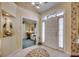 Bright foyer with a large arched window and a view of a home office space at 4494 Aberdeen Way, Myrtle Beach, SC 29579